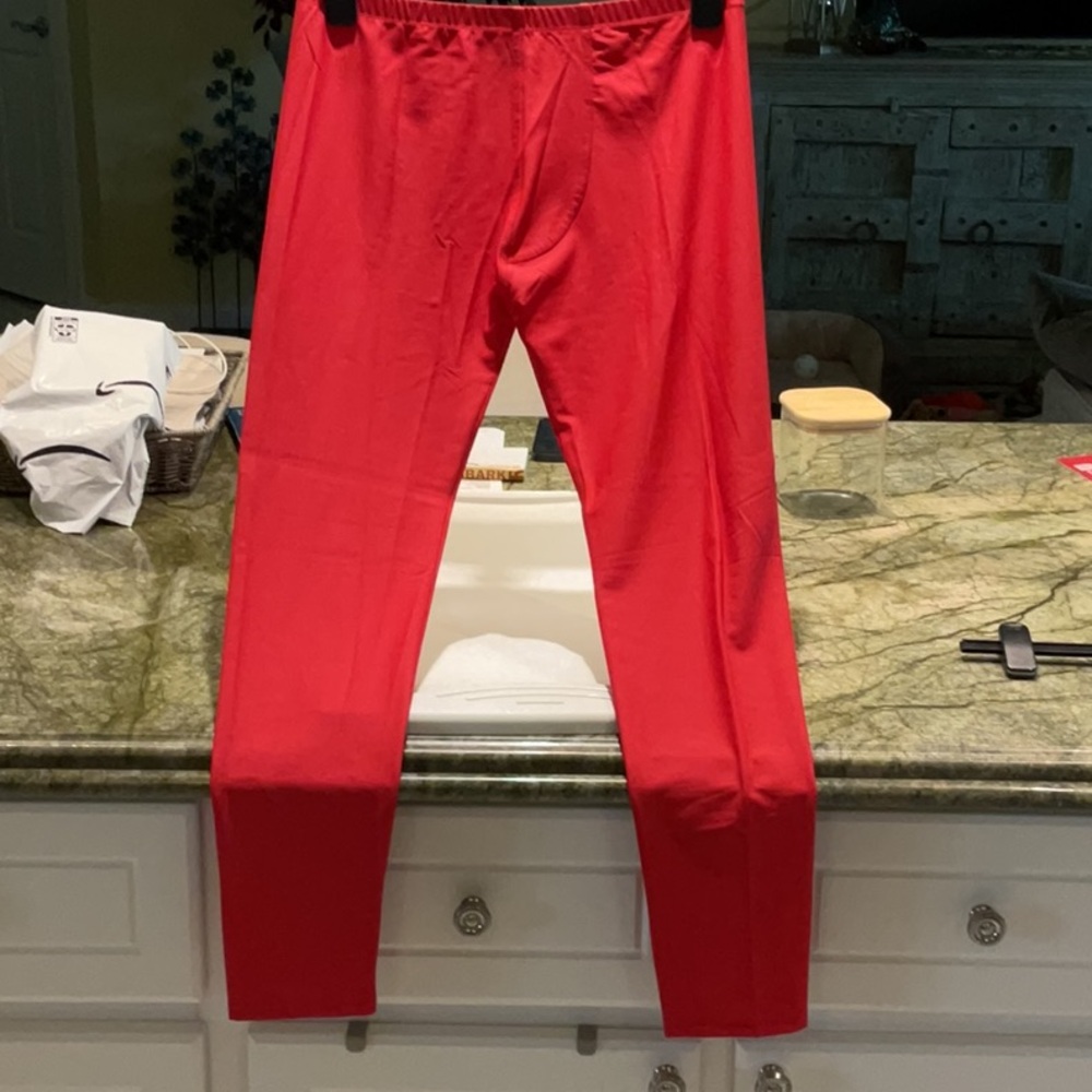 Red Calf length tights, leggings.